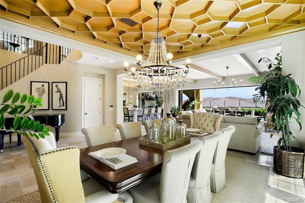 123 Amber Sky Irvine, CA 92618 - Photo 5 of 43 a living room with furniture and a chandelier