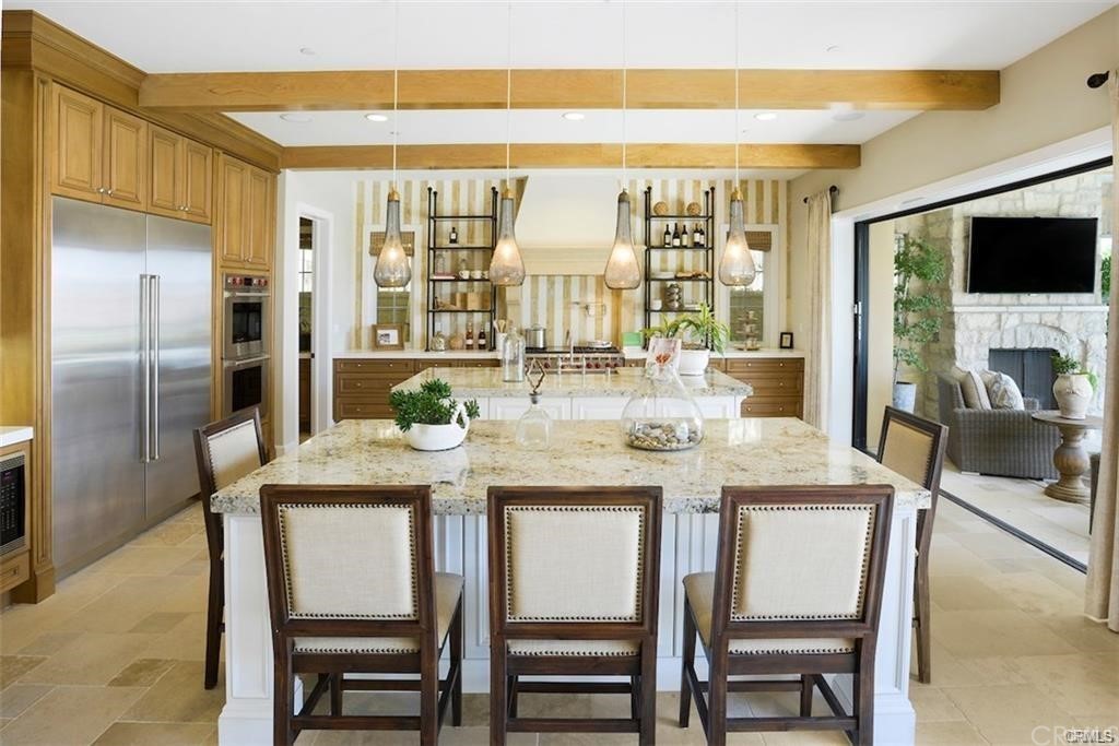 123 Amber Sky Irvine, CA 92618 - Photo 10 of 43 a dining table sitting next to a window