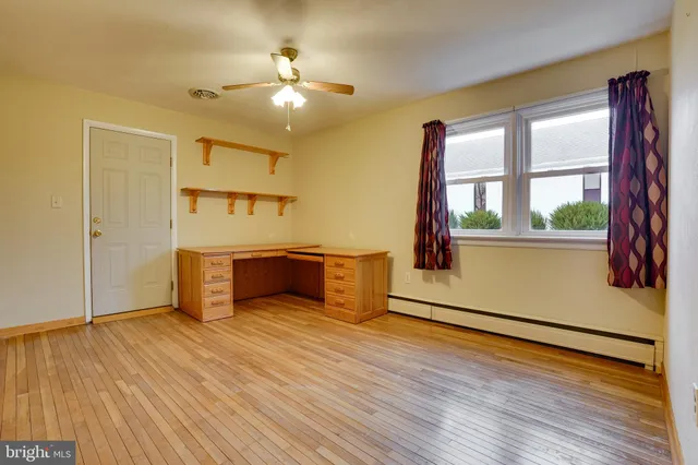 a view of a kitchen with a dishwasher and wooden floor