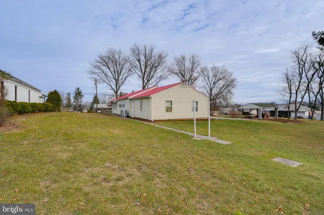 a house with swimming pool in front of it