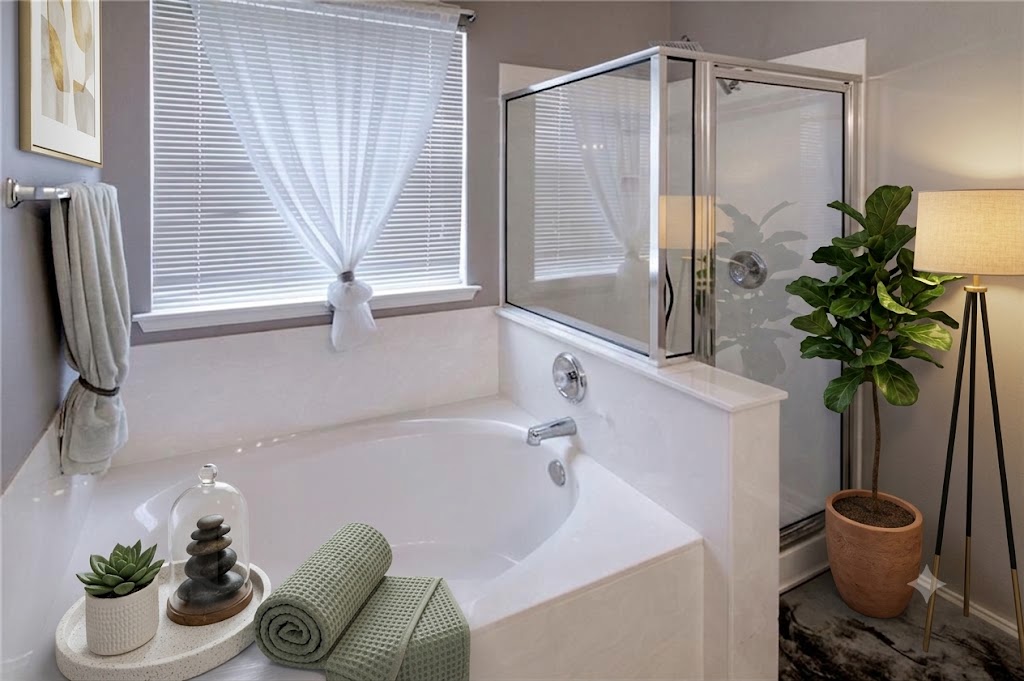 508 Emma Rose Trail Leander, TX 78641 - Photo 4 of 40 Unwind in the primary bath, featuring a soaking tub and a separate glass-enclosed shower.