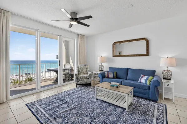 a living room with furniture and a rug