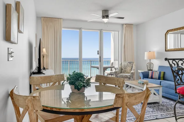 a view of a dining room with furniture and window
