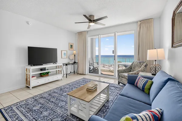 a living room with furniture and a flat screen tv
