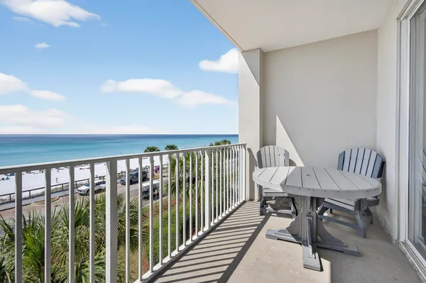 a view of a balcony with furniture