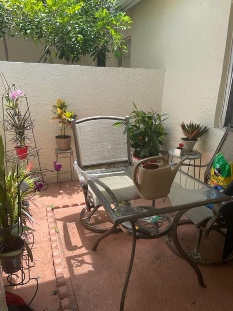 9869 Three Lakes Circle, Unit 6B Boca Raton, FL 33428 - Photo 4 of 8 SWEET FRONT PATIO