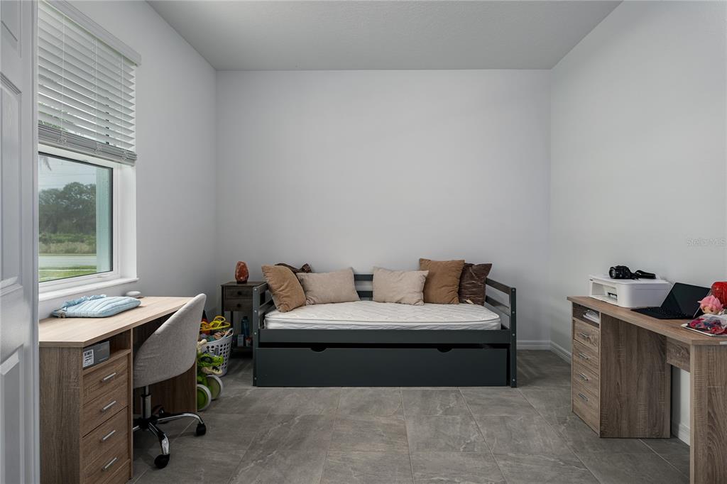 1912 Swivel Lane Sarasota, FL 34240 - Photo 14 of 48 a bedroom with a bed and a window