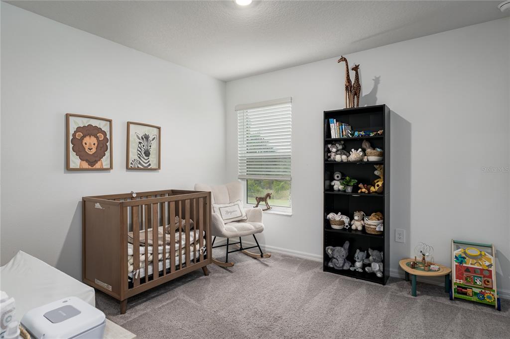 1912 Swivel Lane Sarasota, FL 34240 - Photo 19 of 48 a bedroom with a bed and a window