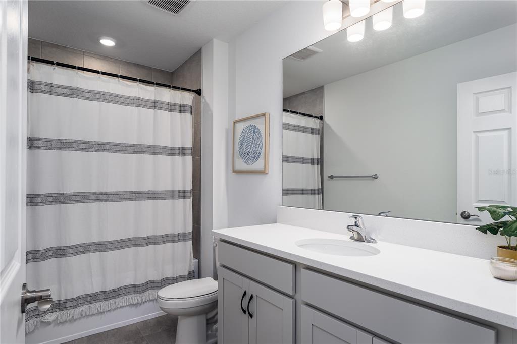 1912 Swivel Lane Sarasota, FL 34240 - Photo 21 of 48 a bathroom with a sink toilet and shower