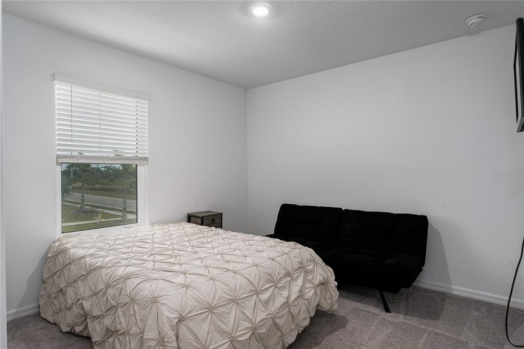 1912 Swivel Lane Sarasota, FL 34240 - Photo 22 of 48 a bedroom with a bed and window