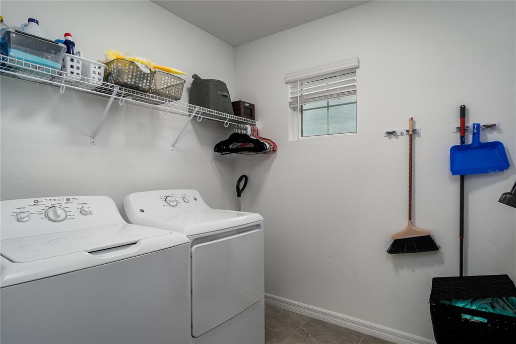 1912 Swivel Lane Sarasota, FL 34240 - Photo 24 of 48 a utility room with dryer and washer