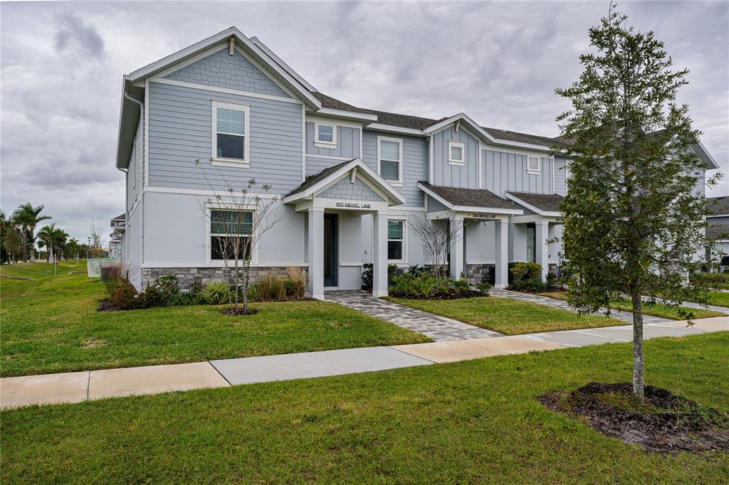 1912 Swivel Lane Sarasota, FL 34240 - Photo 25 of 48 a front view of a house with a yard