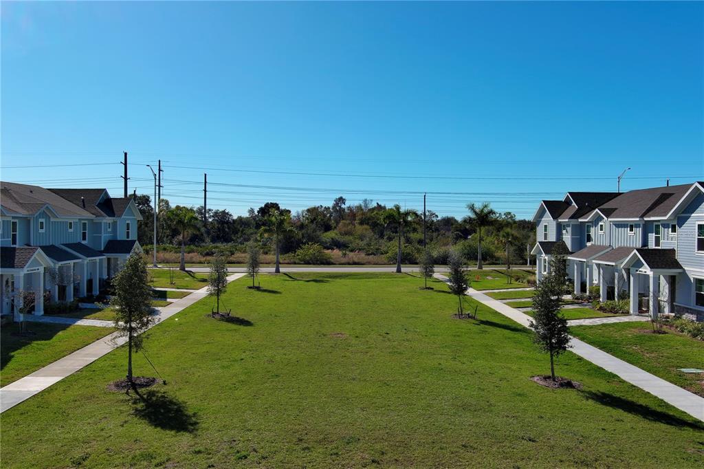 1912 Swivel Lane Sarasota, FL 34240 - Photo 31 of 48 a view of a lake with a yard