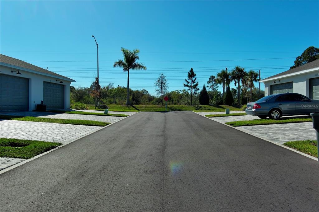 1912 Swivel Lane Sarasota, FL 34240 - Photo 36 of 48 a view of a street with a building and a street sign