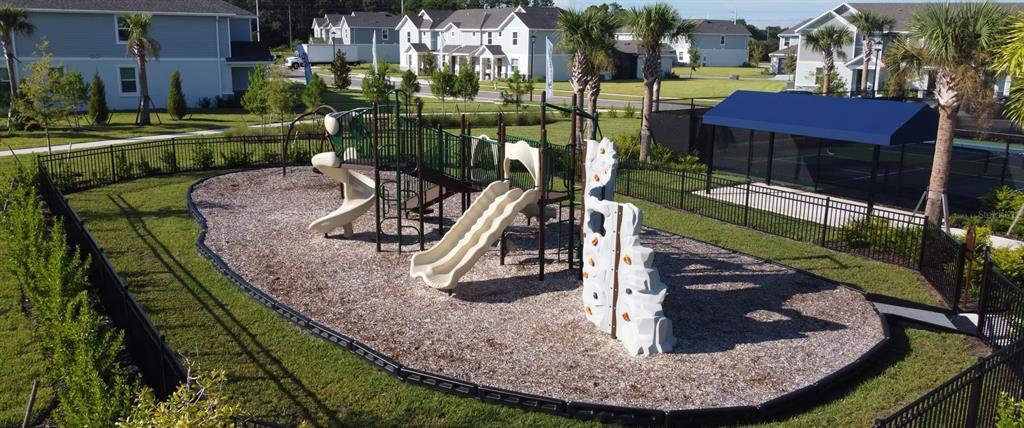 1912 Swivel Lane Sarasota, FL 34240 - Photo 41 of 48 a view of a swimming pool with a yard and plants