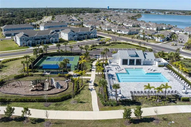 an aerial view of a house with a lake view