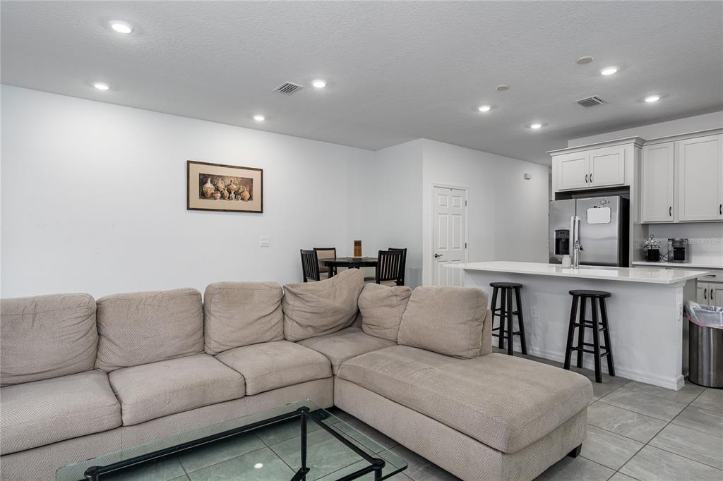 1912 Swivel Lane Sarasota, FL 34240 - Photo 7 of 48 a living room with furniture and a table