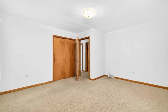 a kitchen with a stove and a refrigerator