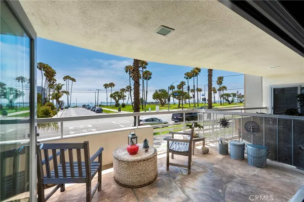 a room with stainless steel appliances kitchen island granite countertop a sink and cabinets