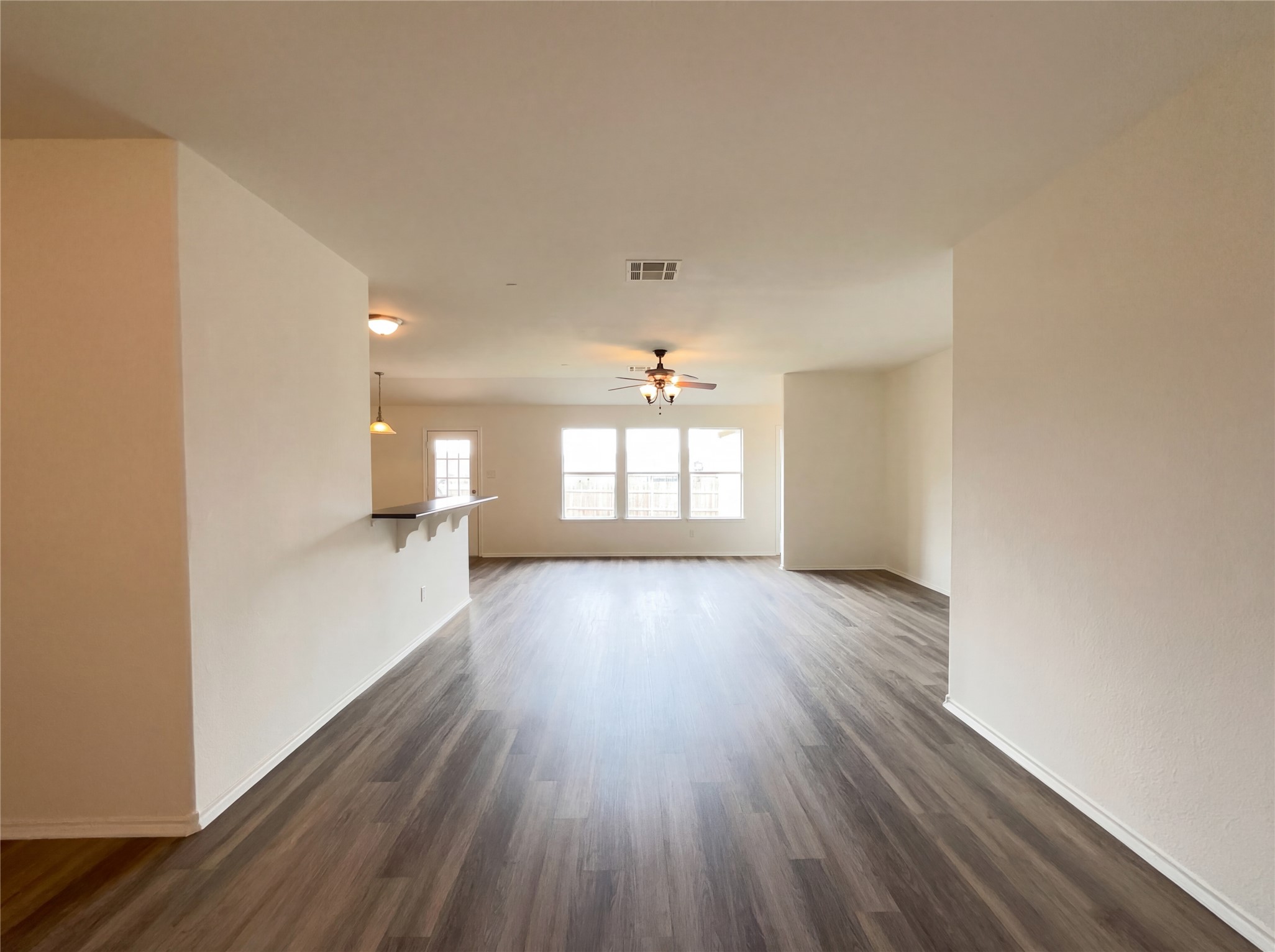 506 Gettysburg Loop Elgin, TX 78621 - Photo 29 of 39 a view of empty room with wooden floor and fan