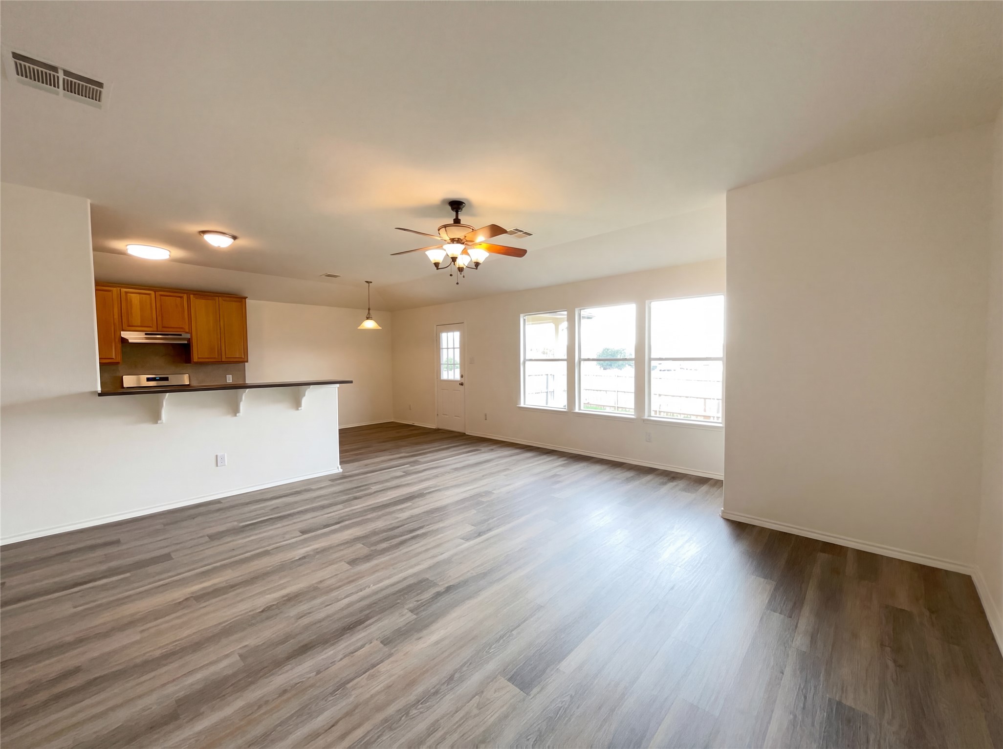 506 Gettysburg Loop Elgin, TX 78621 - Photo 3 of 39 a view of a kitchen with a microwave and a window