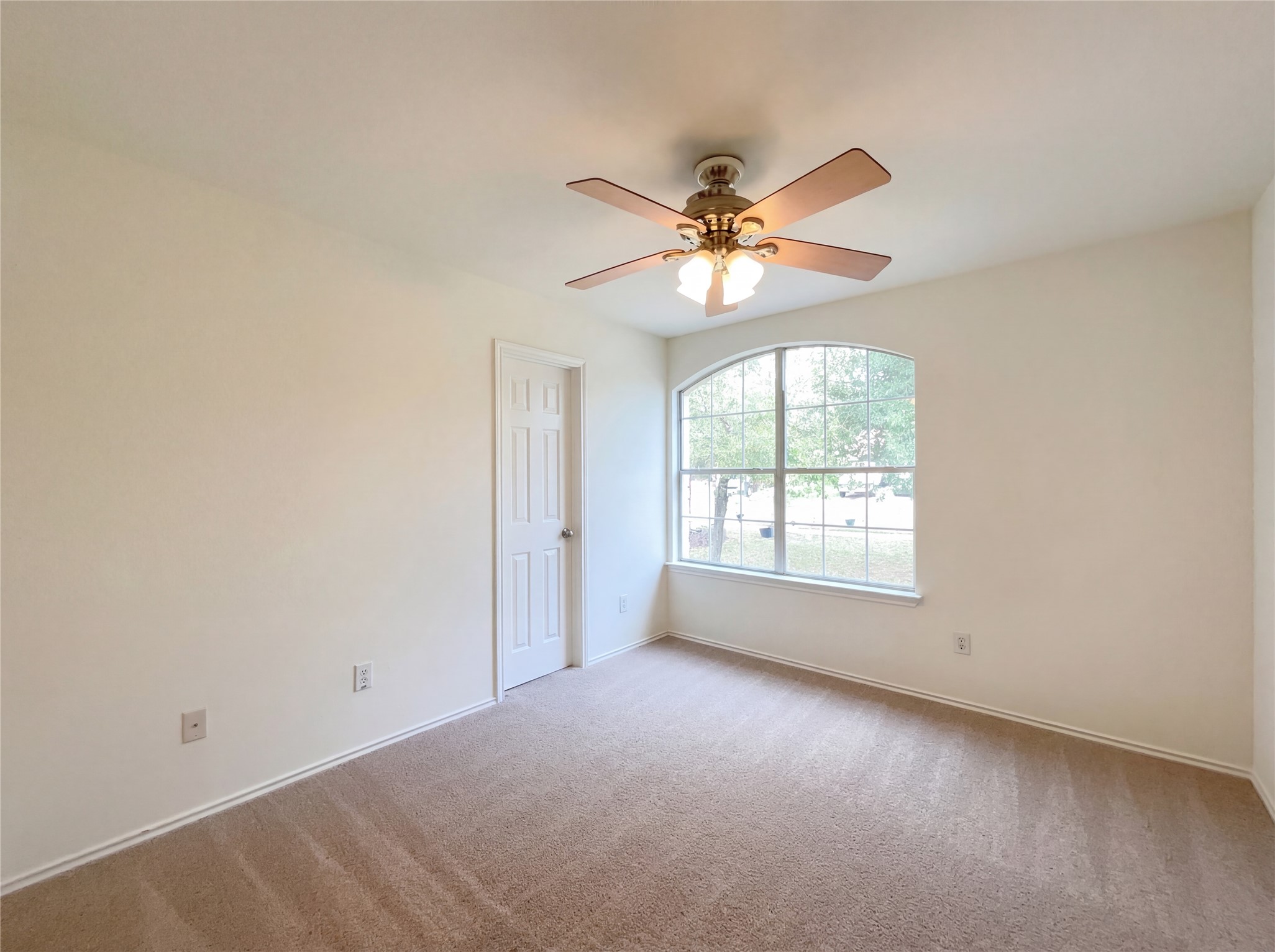 506 Gettysburg Loop Elgin, TX 78621 - Photo 31 of 39 an empty room with a window and a fan
