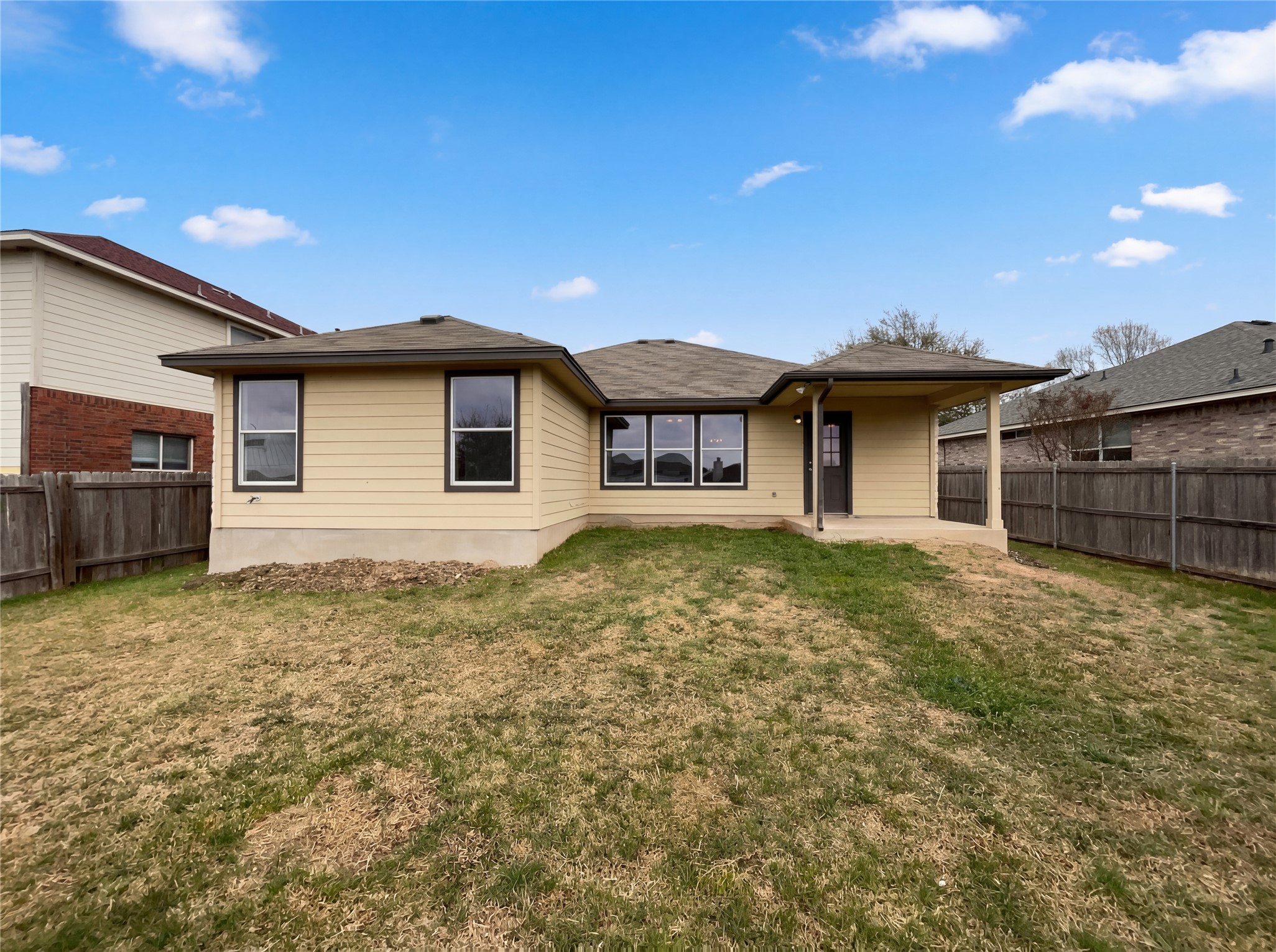 506 Gettysburg Loop Elgin, TX 78621 - Photo 5 of 39 a front view of a house with a yard