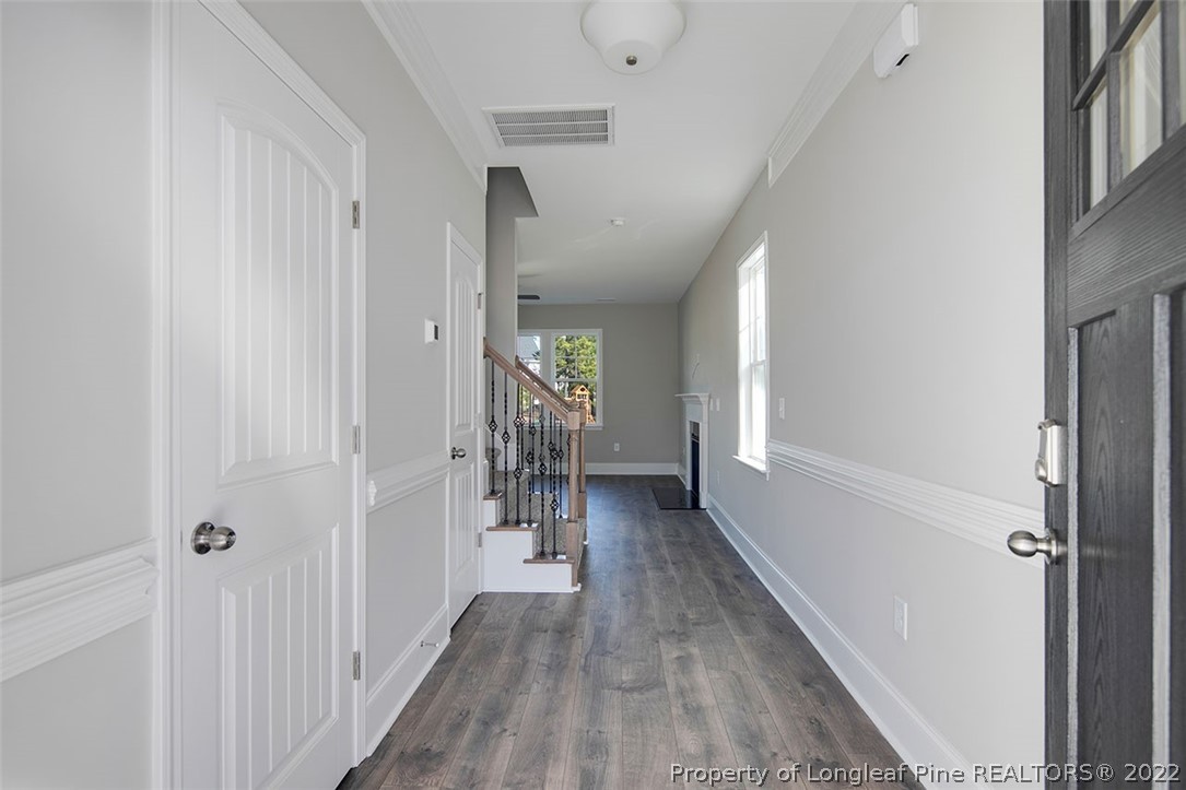 416 Kerr Lake Road Aberdeen, NC 28315 - Photo 5 of 45 a view of a hallway with wooden floor and closet area