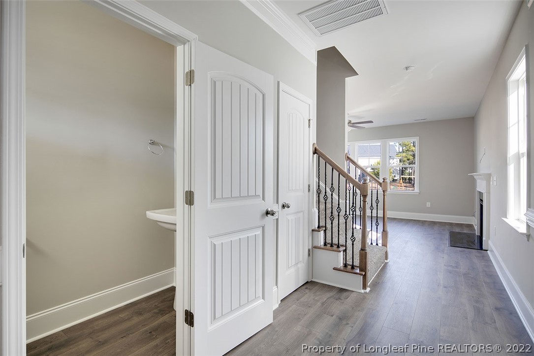 416 Kerr Lake Road Aberdeen, NC 28315 - Photo 6 of 45 a view of a hallway with entryway and wooden floor