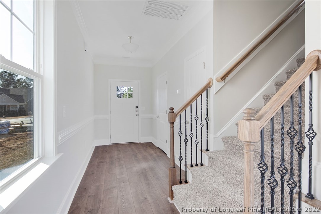416 Kerr Lake Road Aberdeen, NC 28315 - Photo 8 of 45 a view of a hallway with wooden floor and entryway