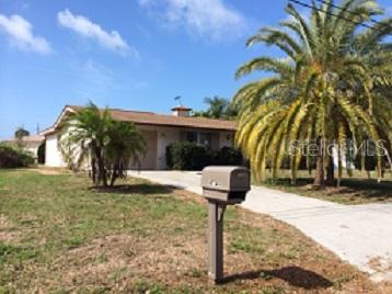 1754 Forest Road Venice, FL 34293 - Photo 1 of 1 a front view of a house with garden