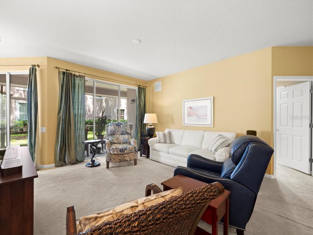 897 Lantern Way Clearwater, FL 33765 - Photo 14 of 56 a living room with furniture and a large window