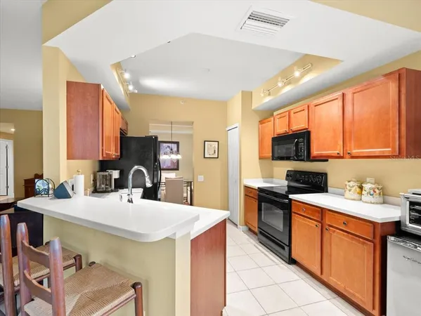 a kitchen with a sink and a wooden cabinets