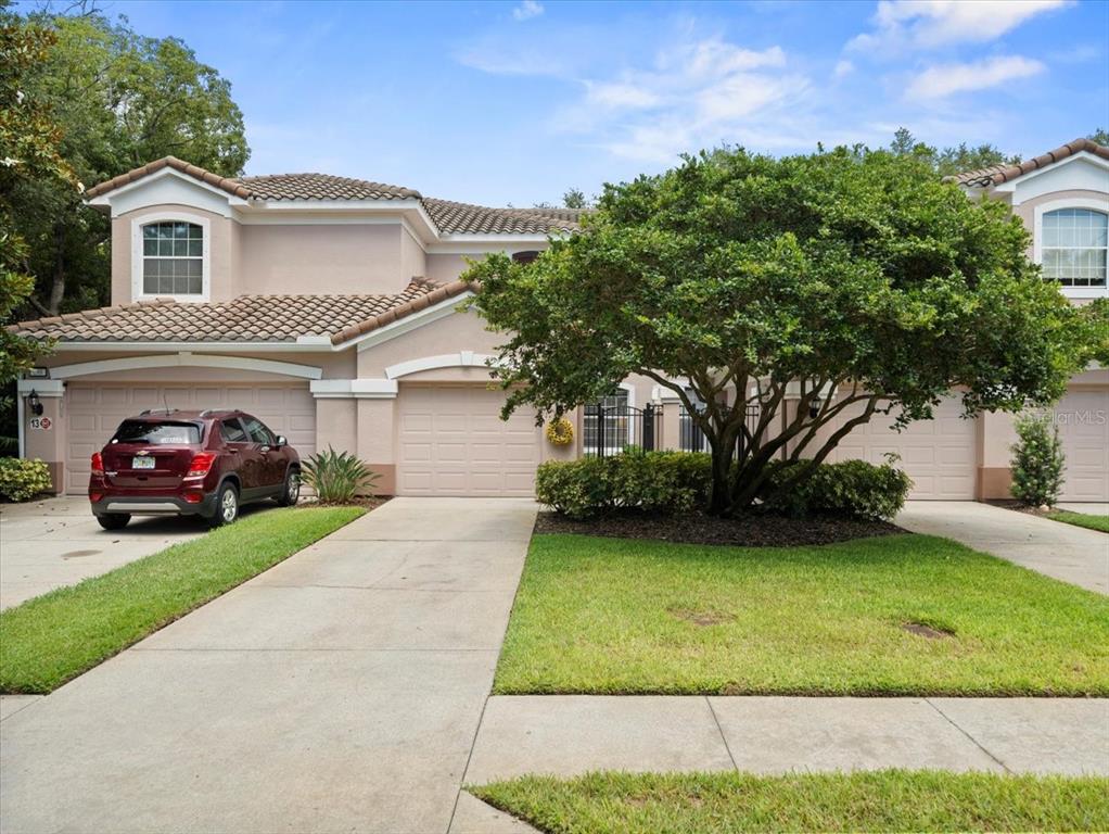897 Lantern Way Clearwater, FL 33765 - Photo 2 of 56 a view of a house with a garden and pathway