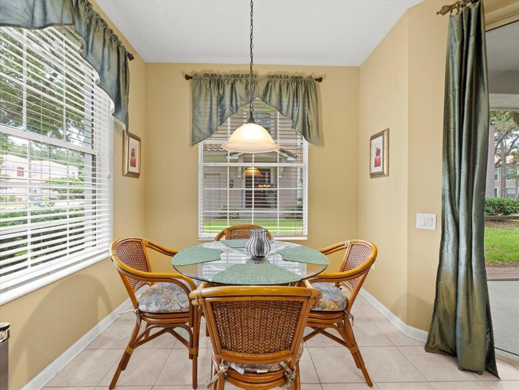 897 Lantern Way Clearwater, FL 33765 - Photo 27 of 56 a dining room with furniture and window