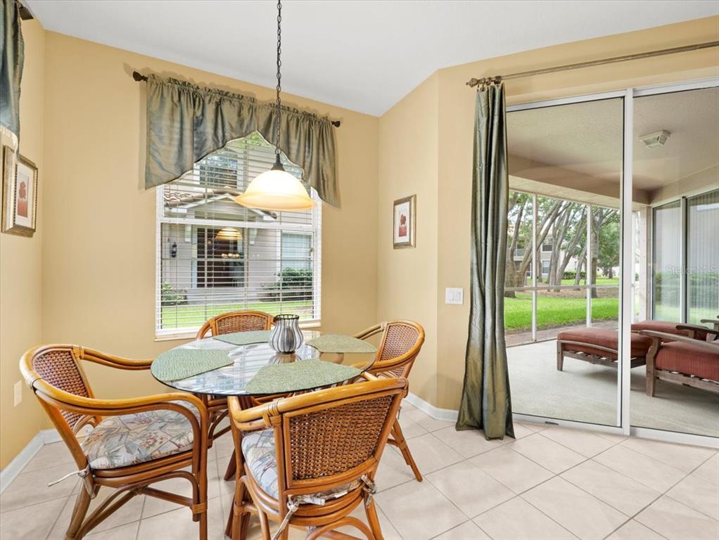 897 Lantern Way Clearwater, FL 33765 - Photo 28 of 56 a dining room with furniture and large windows