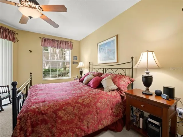 a bathroom with a tub double sink and mirror