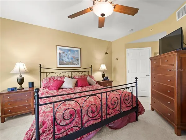 a bedroom with a bed couch and window