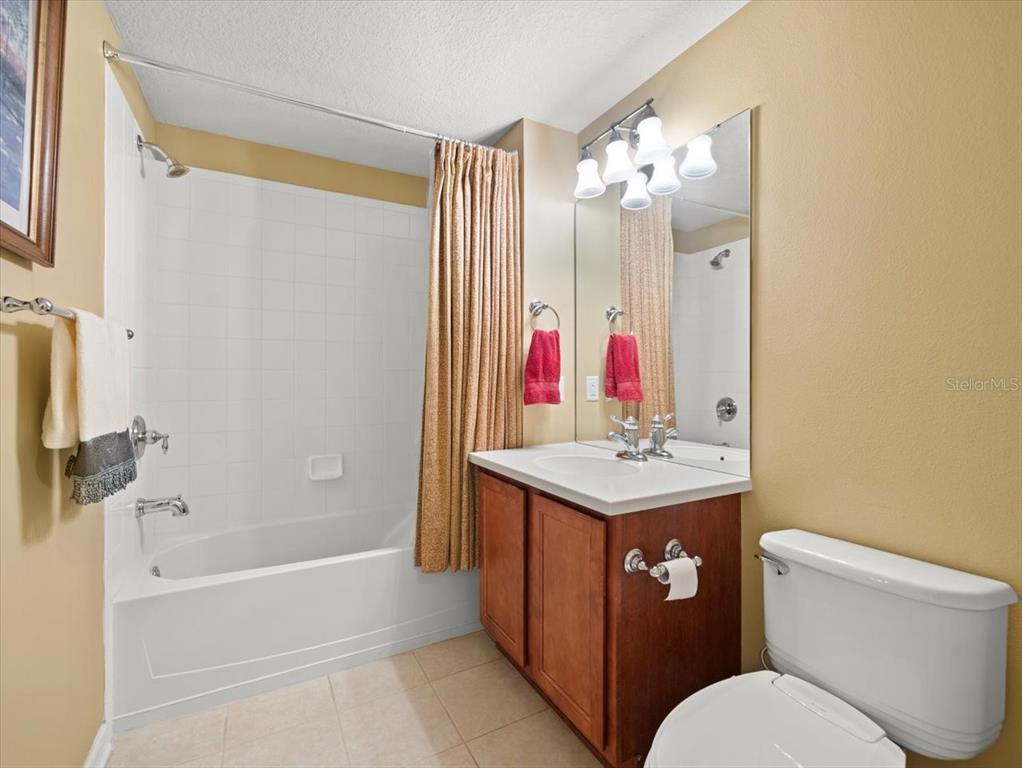 897 Lantern Way Clearwater, FL 33765 - Photo 40 of 56 a bathroom with a sink toilet and shower