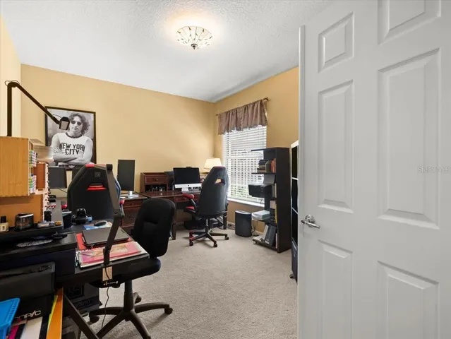 an aerial view of a house with garden space sitting space