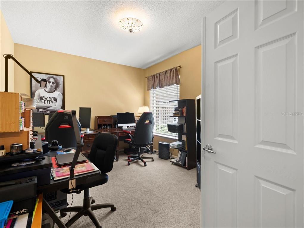 897 Lantern Way Clearwater, FL 33765 - Photo 41 of 56 a view of a workspace with furniture and a window