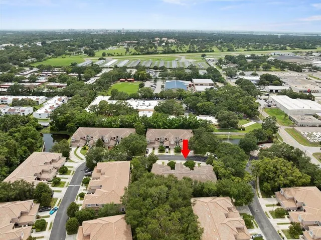 an aerial view of residential houses with outdoor space