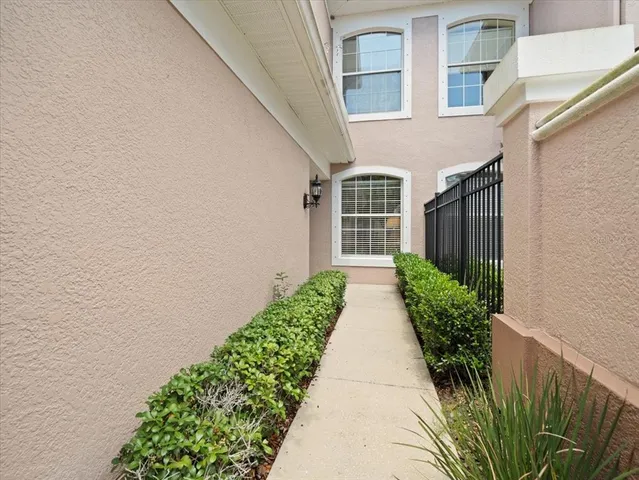 a view of a hallway with wooden floor and entryway