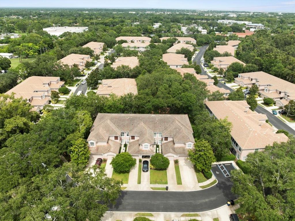 897 Lantern Way Clearwater, FL 33765 - Photo 53 of 56 an aerial view of a house with a yard and lake view