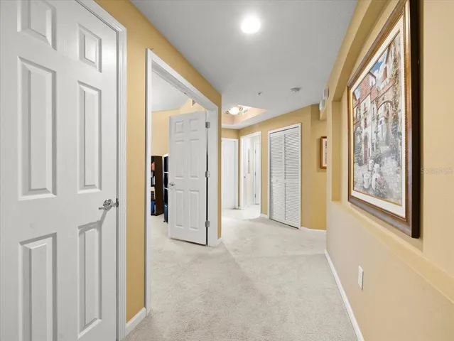 a dining room with furniture a chandelier and window