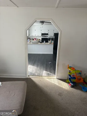 a kitchen with a sink and appliances
