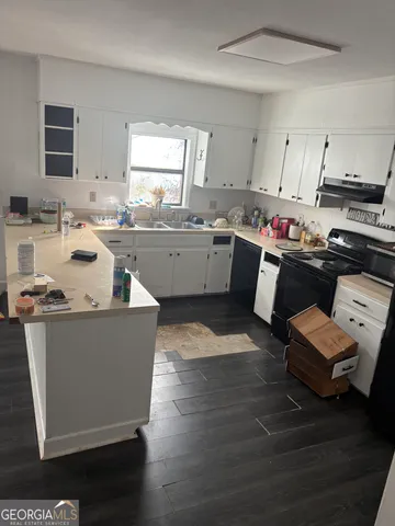 a view of empty room with windows