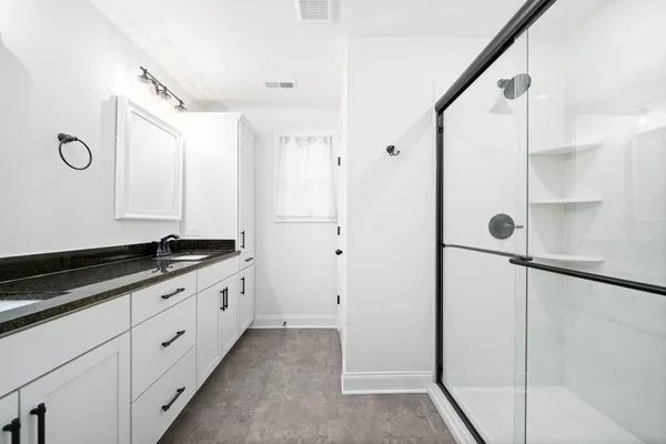 a close view of a sink and a mirror of a bathroom