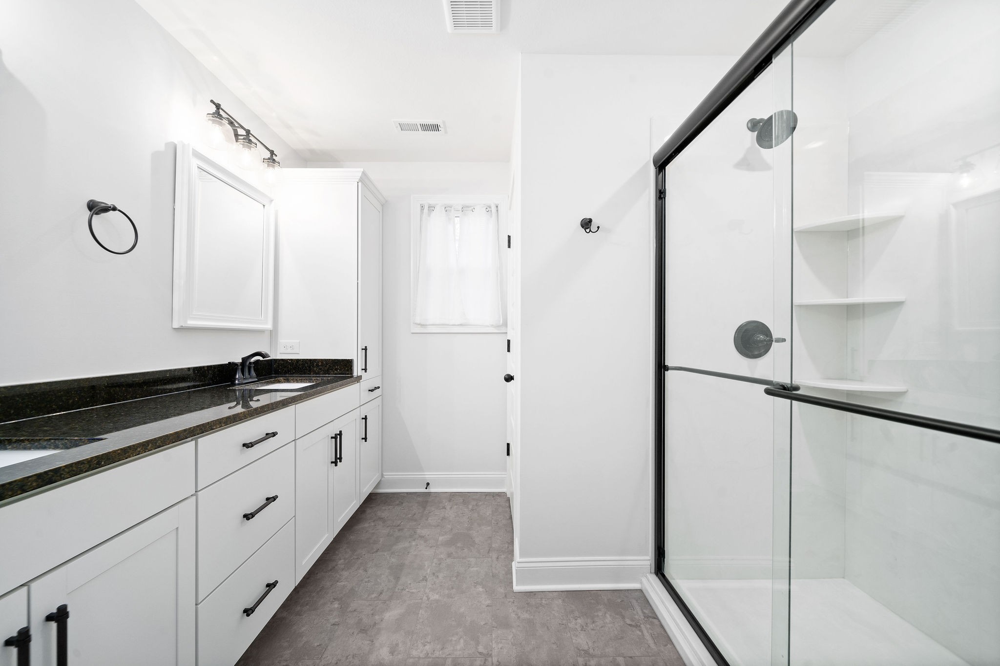 472 Hawkins Road Clarksville, TN 37040 - Photo 20 of 33 a bathroom with a granite countertop sink a mirror and a shower