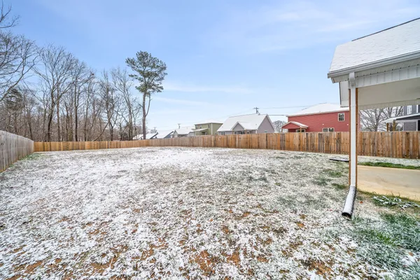 a view of a backyard of the house